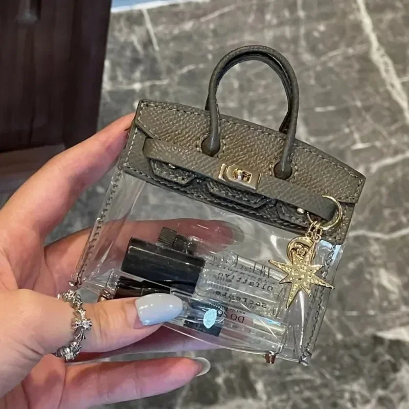 กระเป๋าเก็บกุญแจรถโปร่งใส Platinum ชุดกุญแจรูปร่างน้ําหอมลิปสติกหูฟังกล่องเก็บพวงกุญแจอัตโนมัติกระเป๋าถือขนาดเล็กชุด