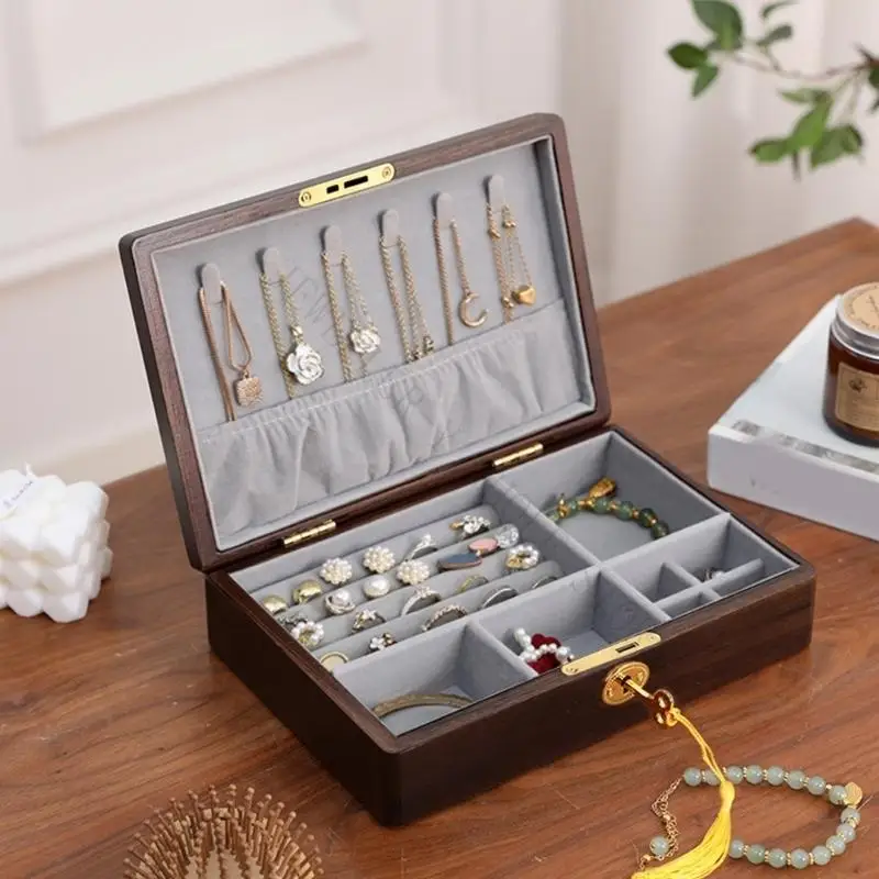 R7UF Jewelry Display Box with Hinged Star-Pattern Lid, Separate Lower Compartments, Ring Rolls, and Necklace Storage Area
