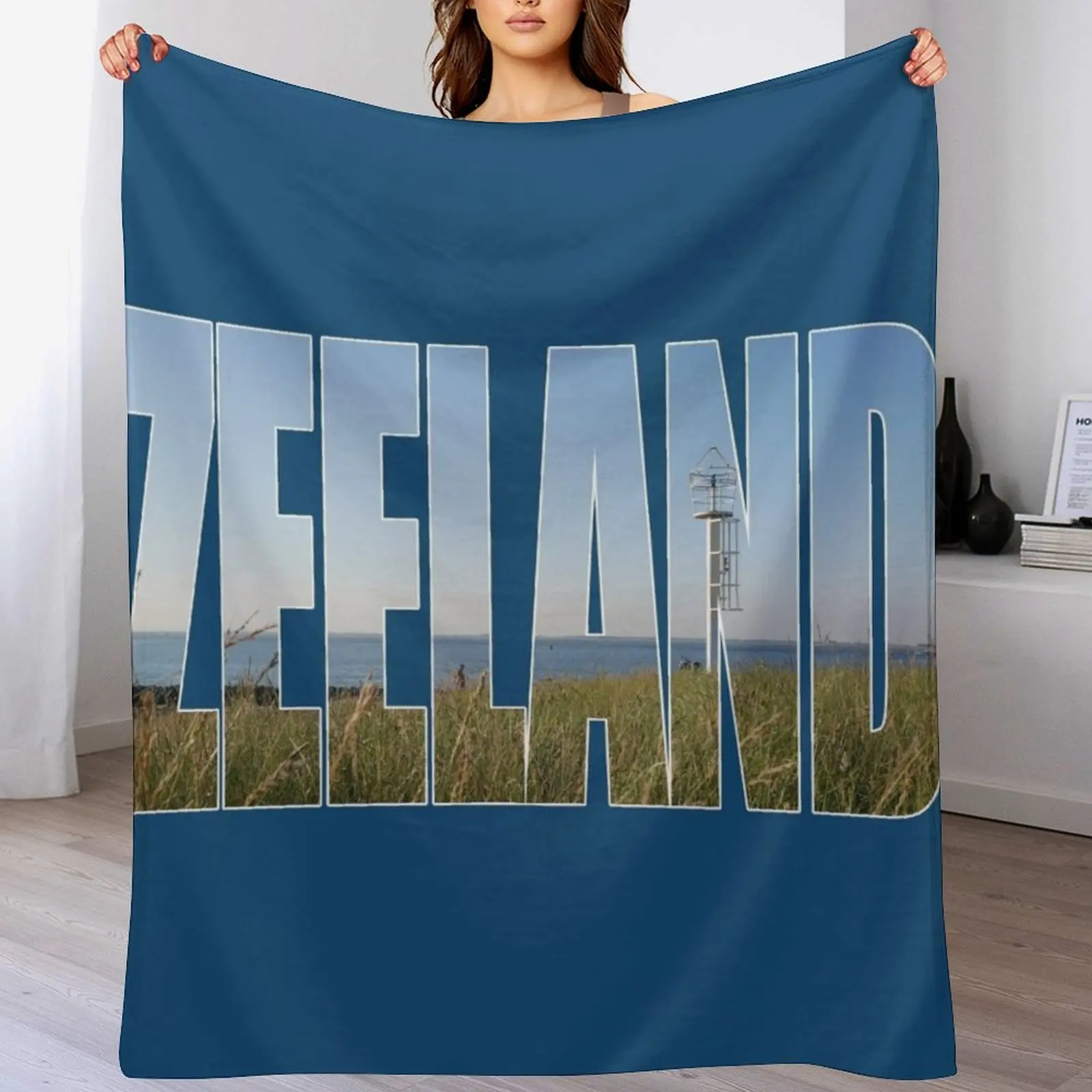 Text Zeeland with overlay of a land and sea landscape in a photo of zeeland in the Netherlands Throw Blanket Warm Blankets