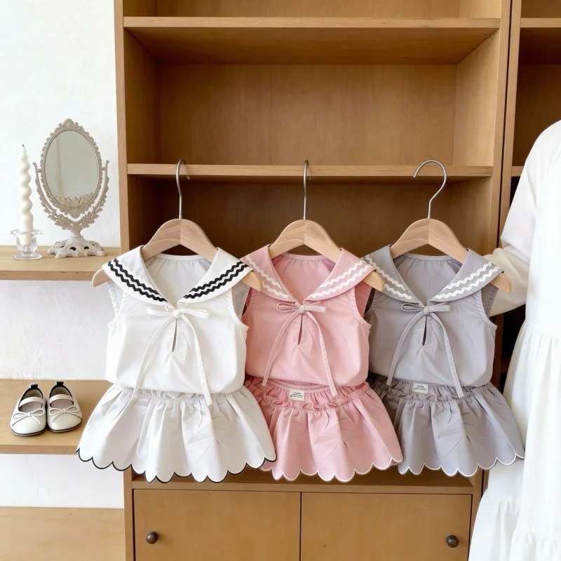 

2026 Spring New Children Sleeveless Clothes Set Girls Lapel Cute Sweet Bow Tops + Shorts 2pcs Suit Solid Toddler Cotton Outfits