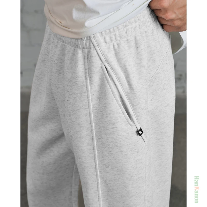 กางเกงวอร์มขาตรงแบบถักสำหรับผู้ชาย สไตล์อเมริกันลำลอง เหมาะสำหรับเล่นบาสเกตบอลและวิ่ง ผลิตจากผ้าฝ้าย 64% ระบายอากาศได้ดี ซับเหงื่อ