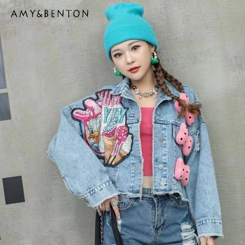 

Осенняя коллекция 2026: Милая персонализированная джинсовая куртка с бисером и мультяшным принтом для женщин, свободный крой Y2K, укороченная, стройнящая верхняя одежда в стиле Y2K