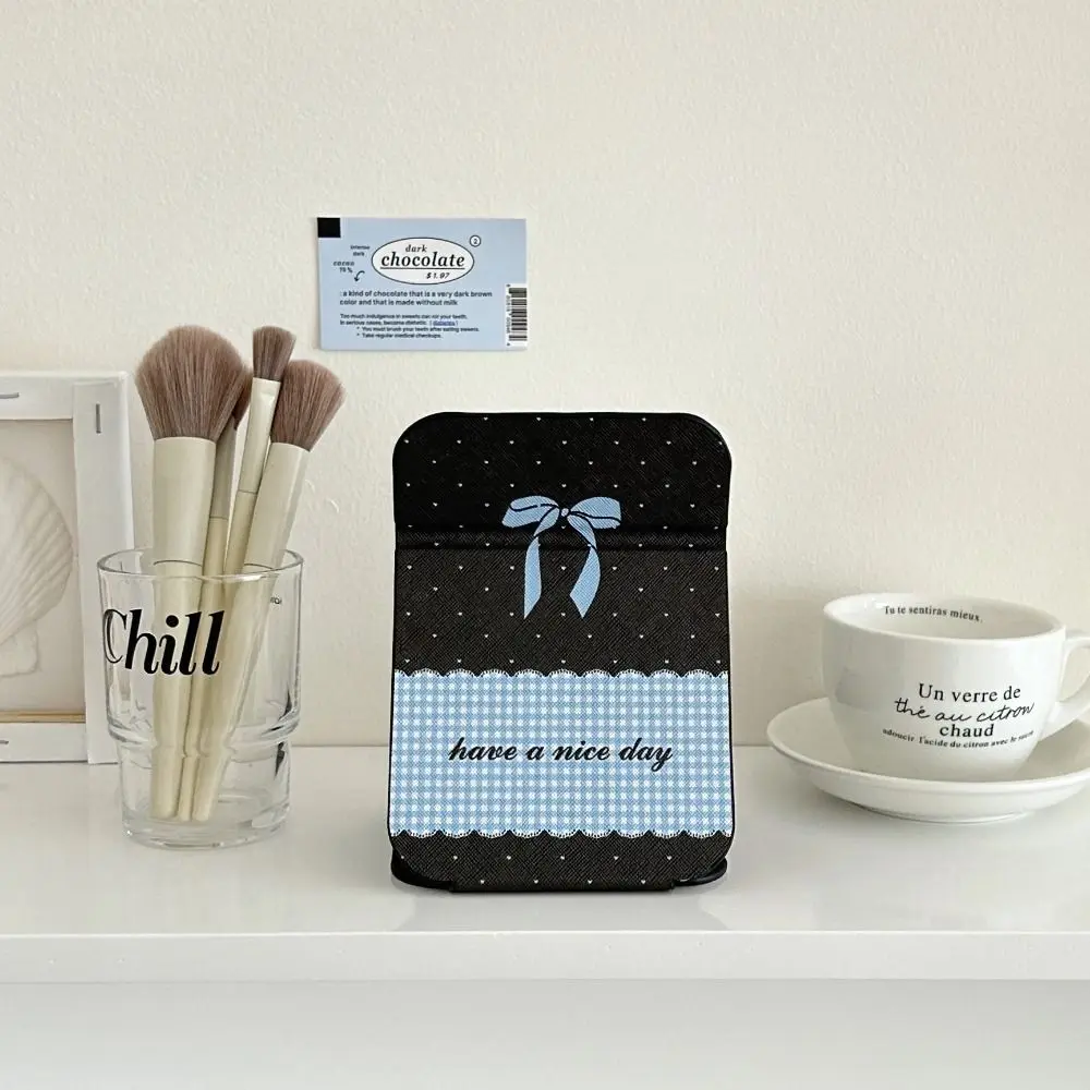 Espejo portátil de cuero Pu con soporte de escritorio, espejo de maquillaje plegable con lazo rosa, ligero, delicado espejo de maquillaje de bolsillo Unisex