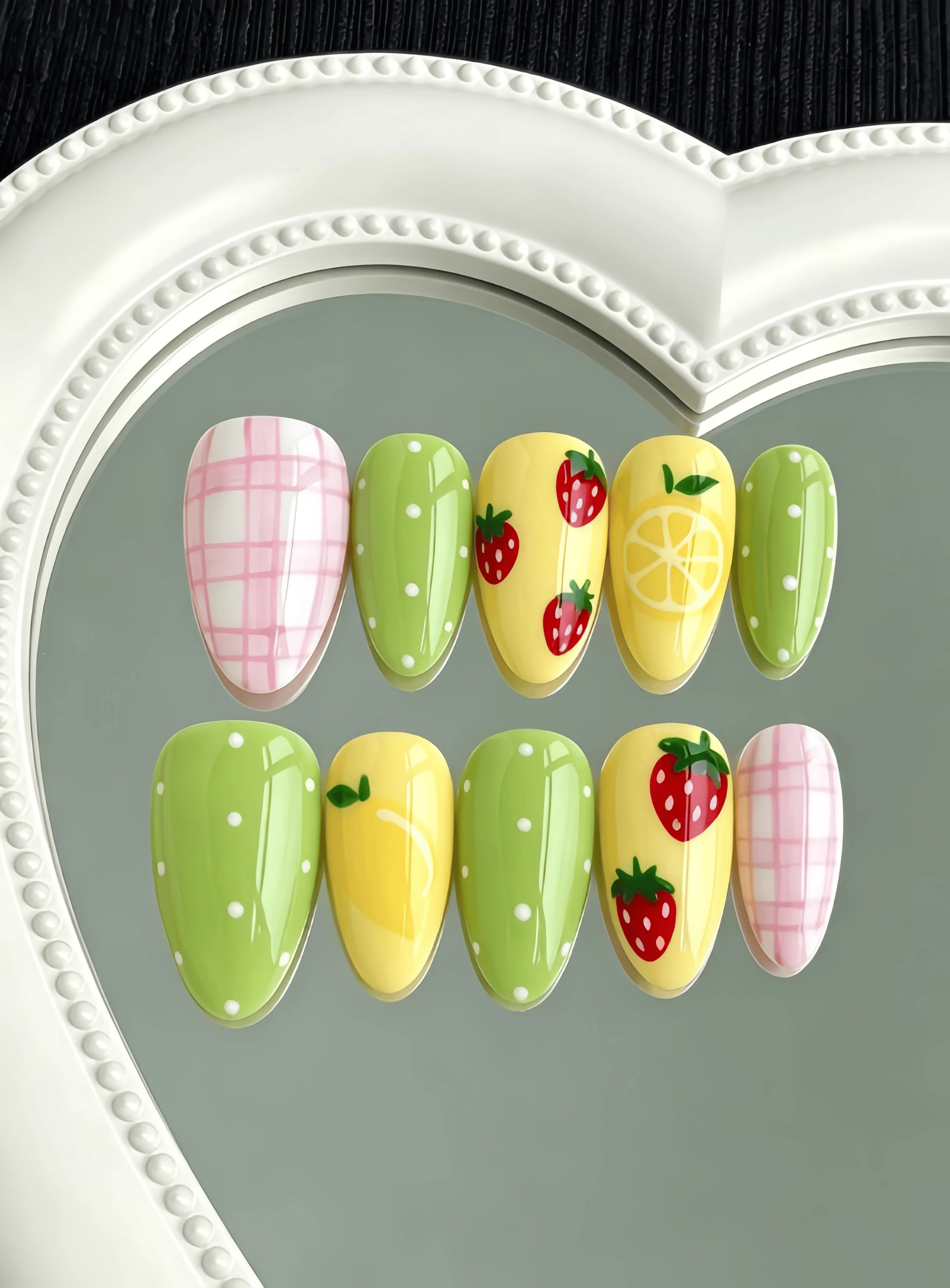 10 Pieces of Handmade Almond-Shaped Full-Cover Nail Tips, Medium Length, with a Fresh Yellow-Green-Pink Color Scheme Featuring Hand-Painted Strawberry and Lemon Designs, Small Polka Dots, and Pink Plaid Patterns, in a Vibrant Summer Sweet Girl Style, Suitable for Women and Girls, Perfect for Summer Vacations, Graduation Season, and as a Gift, Comes with 1 Piece of Jelly Glue and 1 Nail File