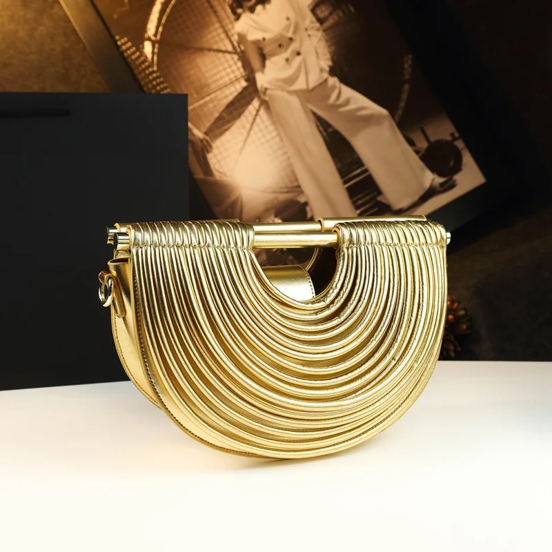Unique three-dimensional striped semi-circular handbag, equipped with a detachable shoulder strap, is a multifunctional women's