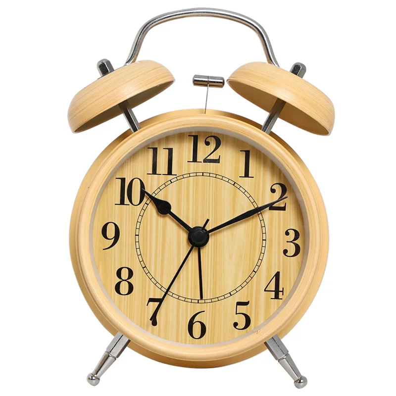 Mini alarm clock rings. Silent electronic clock for bedroom. Student's wake-up device. Nightlight clock