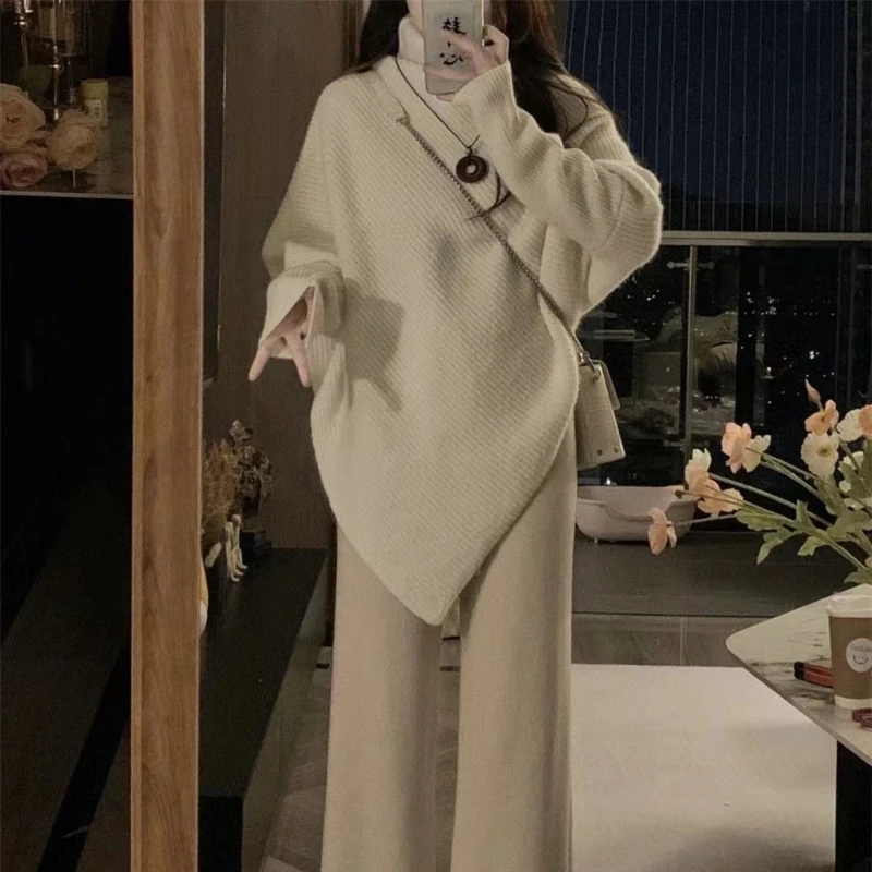 เสื้อสเวตเตอร์ถักไหมพรมทรงไม่สมมาตร แขนยาวทรงปีกค้างคาว สำหรับผู้หญิง สไตล์สตรีทแวร์ลำลอง เหมาะสำหรับฤดูใบไม้ร่วงและฤดูหนาว คอเต่า