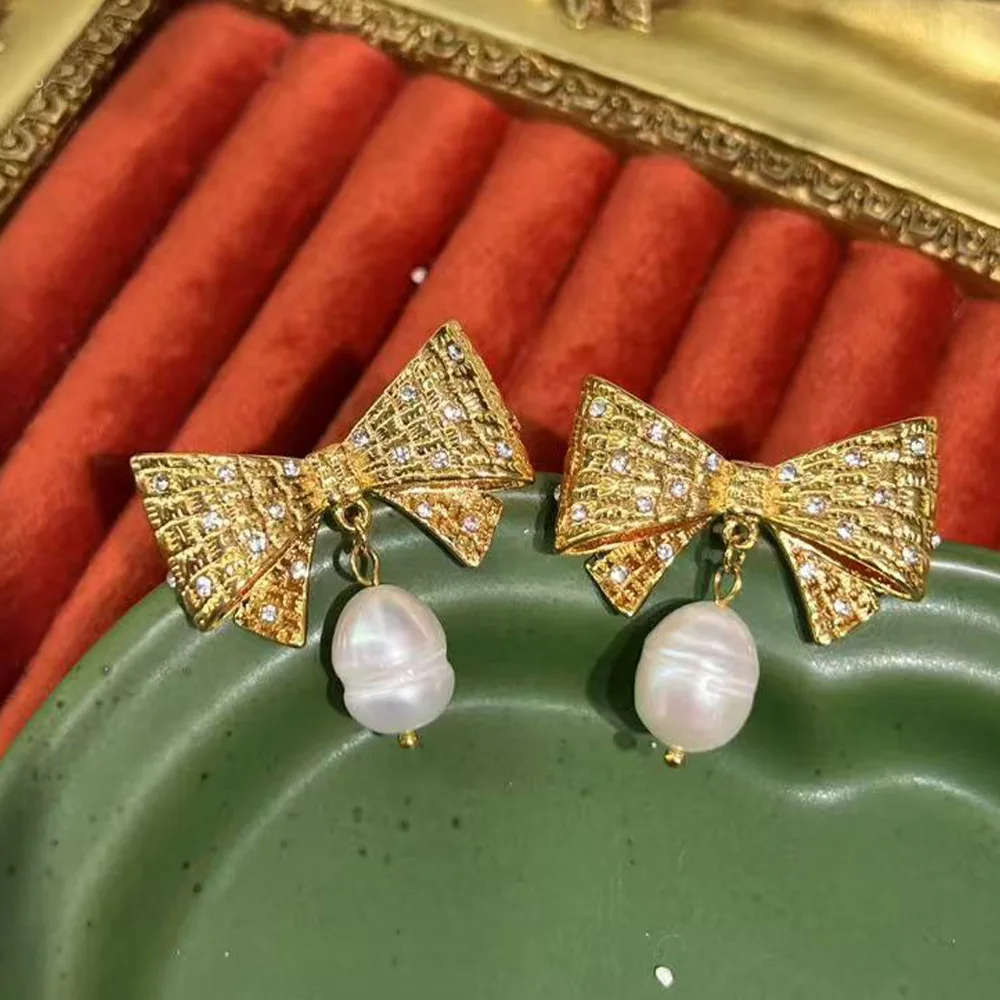 Sweet temperament bow shape with diamonds age-reducing fashion freshwater pearl earrings European and American jewelry