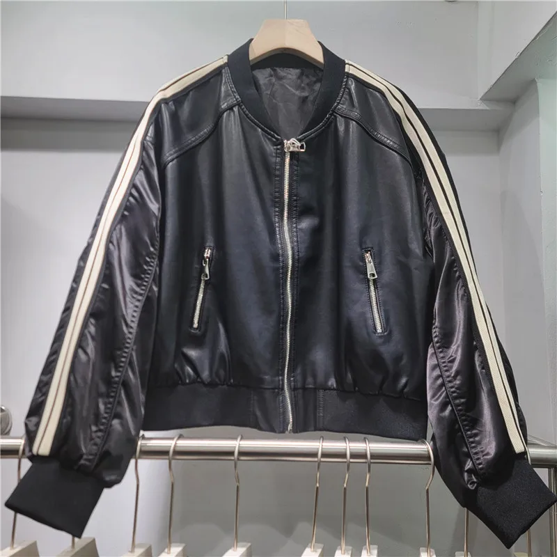 

Cropped & Oversized Moto Jacket: Features trendy patchwork panels. The ultimate edgy statement for Early Fall.