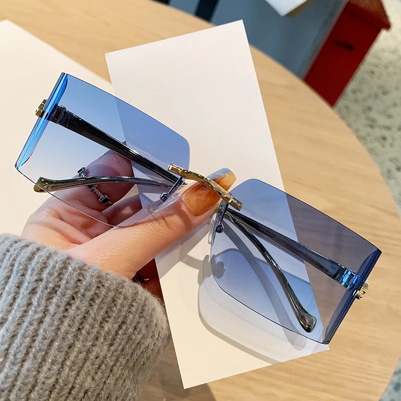 Women's Sunglasses Frameless Edge Cut Sunglasses Fashionable Leopard Head High-end Curved Car Sunglasses 90299