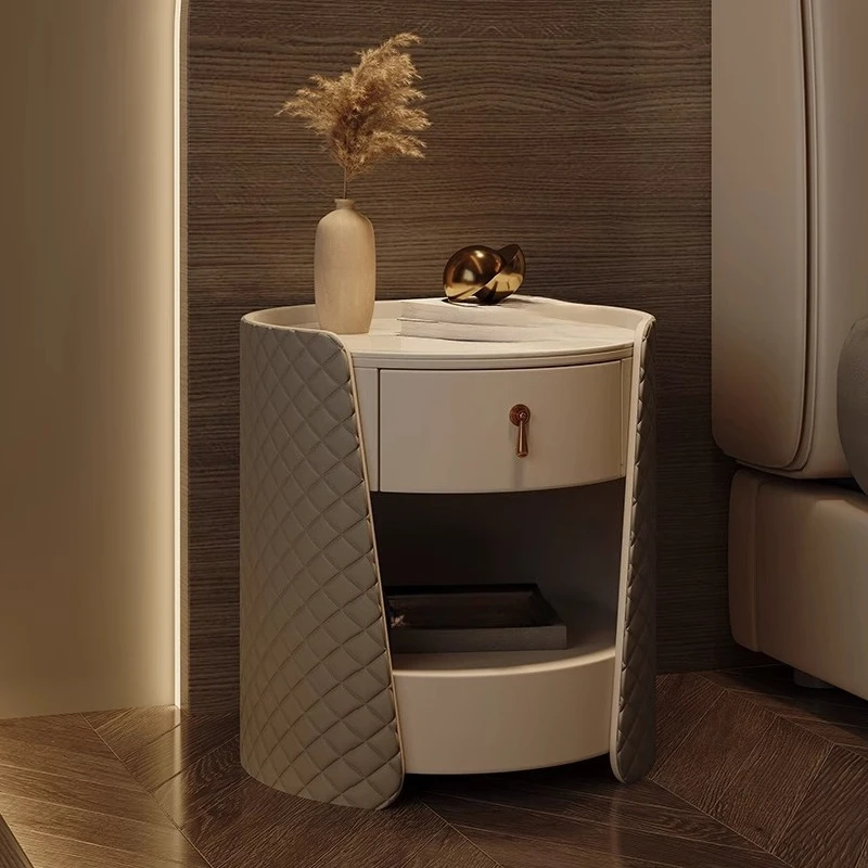 

Italian minimalist design, round leather art bedside table, light luxury rock slab bedside table, bedroom locker