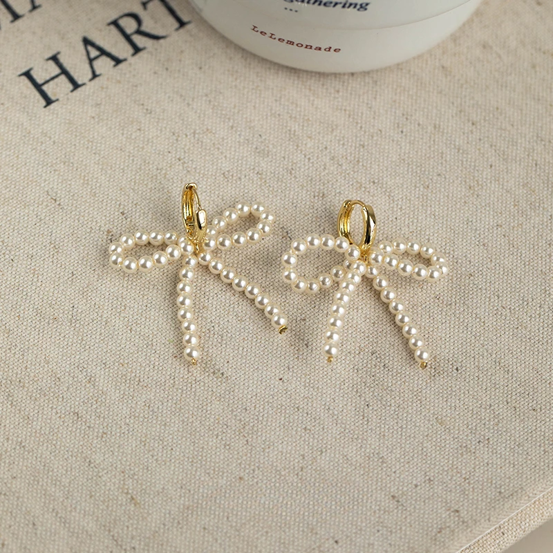 

Retro Girl Light Luxury Bow Premium Cream Pearl Earrings
