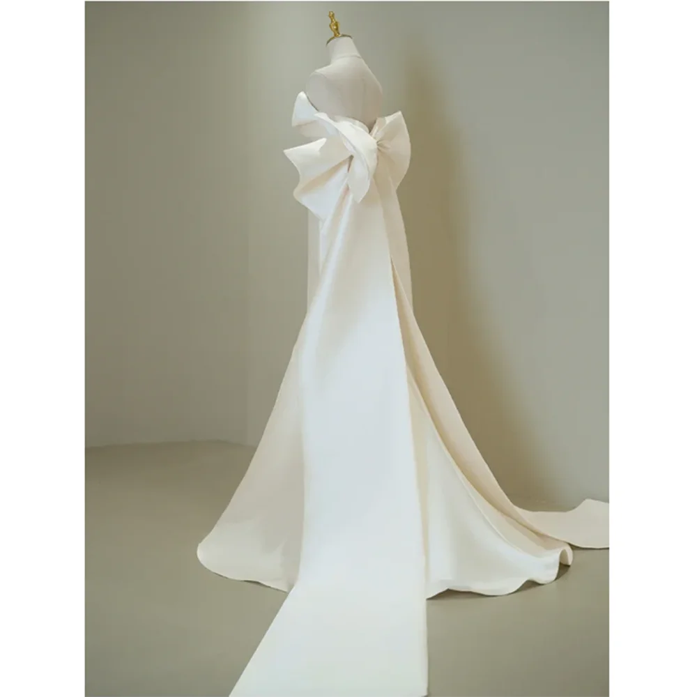 Elegante y exquisito vestido blanco para fiesta De boda para mujer, sin tirantes, sin mangas, largo hasta el suelo, trompeta, lazo De lujo, فستان mire Robe De Mari