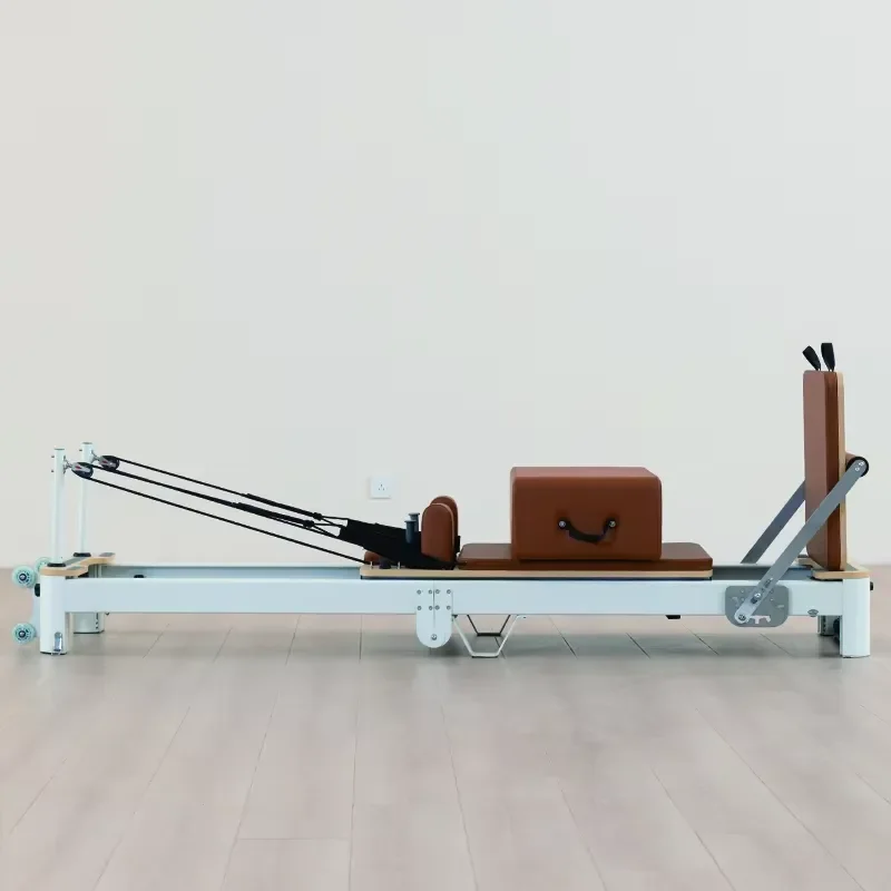Space-Saving Folding Aluminum Pilates Reformer Designed for Urban Home Gyms and Boutique Studios