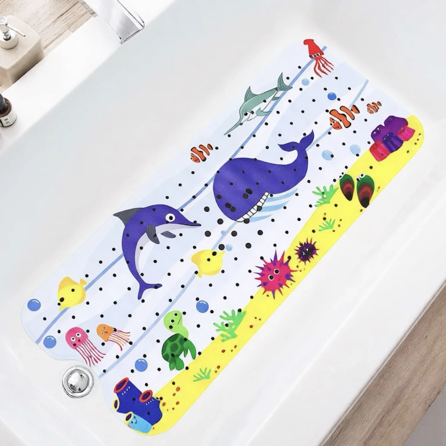 White cartoon bathtub mat with suction cups on a blue tub edge.