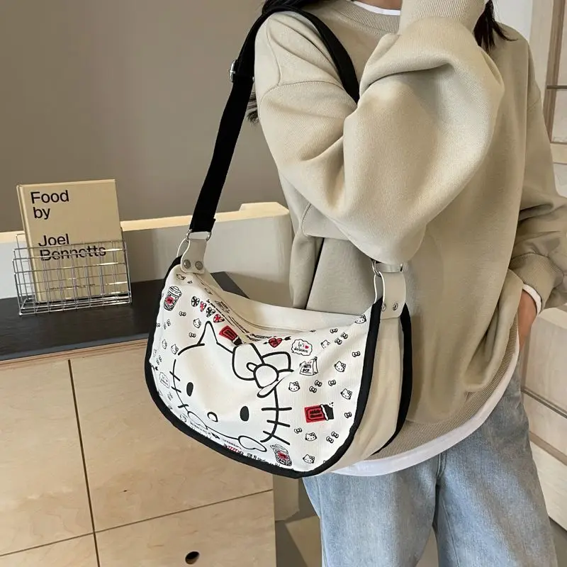 2024 New Sanrio Hello Kittys borsa di tela simpatico cartone animato stampa a schermo intero ragazza cuore Casual Versatile borsa a tracolla giocattoli regali per ragazza