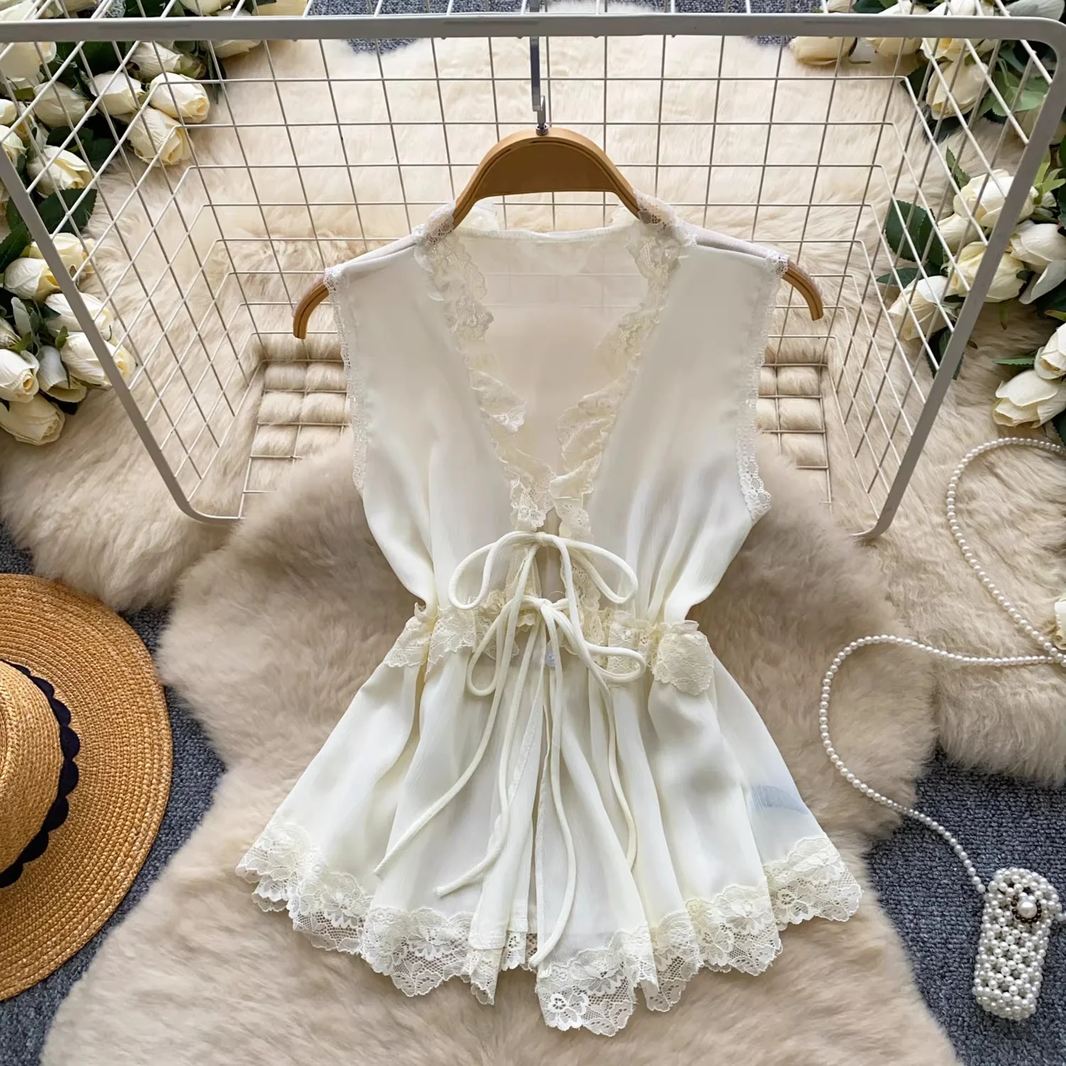 

Clothland Women Sweet Lace Blouse V Neck Lace Up Sleeveless Chiffon Shirt See Through Female Fashion Tops Blusa WA441