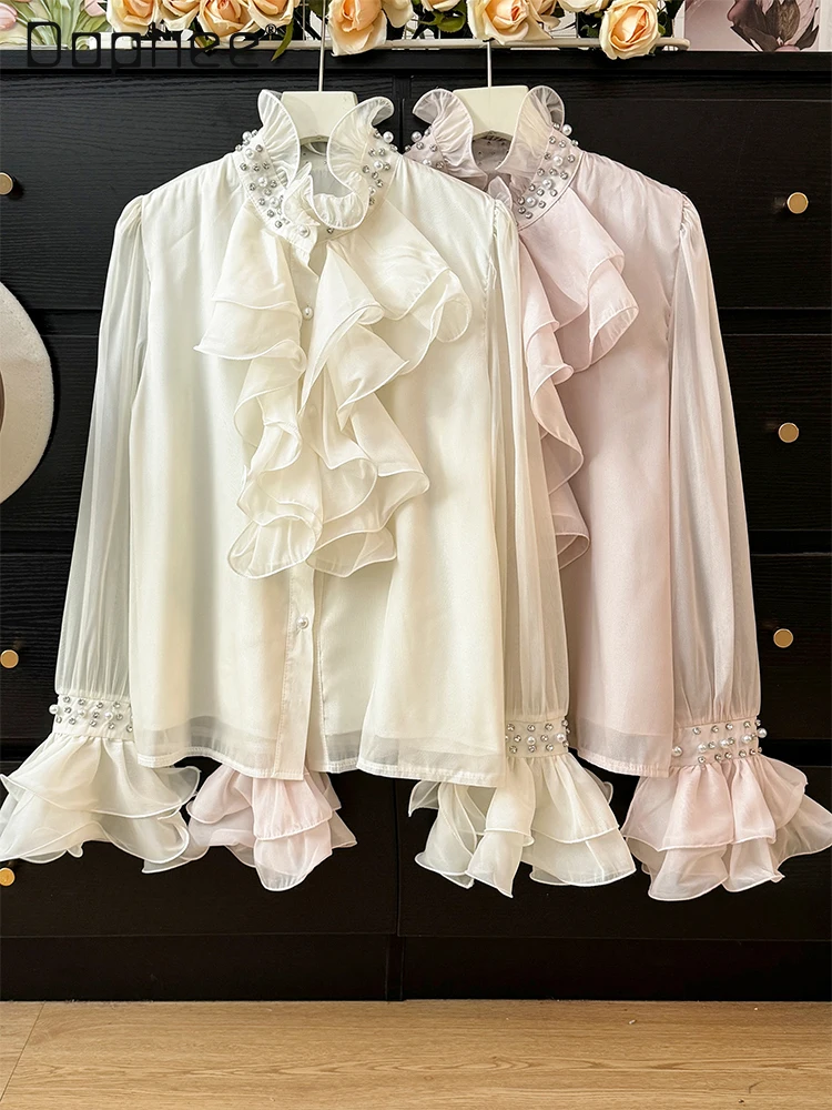 Camisa de manga acampanada con cuello levantado y perlas de gama alta de estilo francés para mujer otoño 2025 Top elegante de moda con una sola botonadura