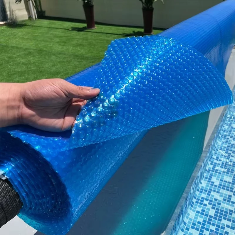 solar pool cover with a variety of bubbles, colors, and thicknesses enhances the pool's absorption of sunlight.