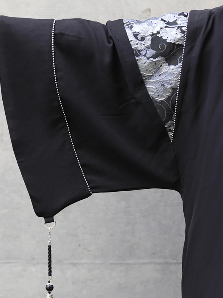 

Уличная куртка оверсайз унисекс с декоративными кисточками, комбинированная из полиуретана и эластичного волокна, с V-образным вырезом, длинный рукав