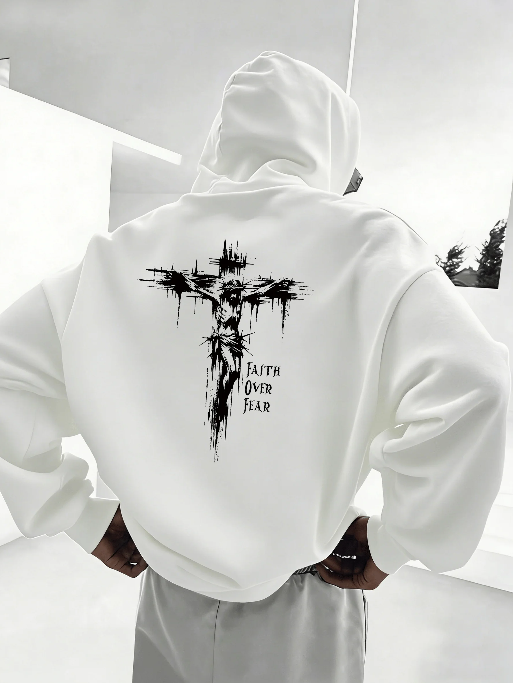 Cross-shaped dark-haired men's hooded sweatshirt with distressed cross pattern. A fashionable and comfortable style.