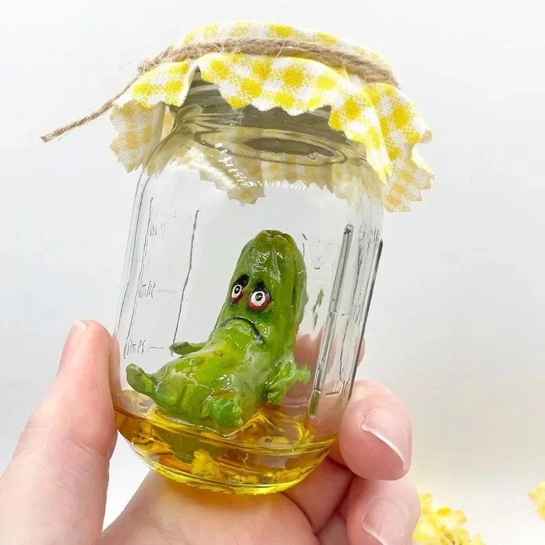

1Pcs Grumpy Pickle in A Jar Sculpture Creative Mini Grumpy Clear Glass Pickle Statue Funny Aojiao Jar Pickle Cartoon Display