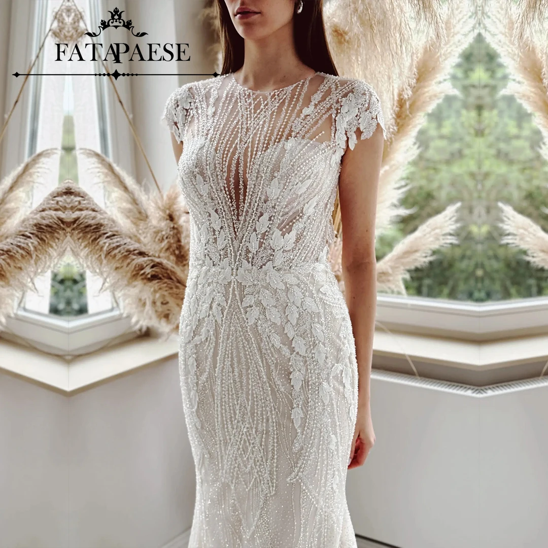 

FATAPAESE Wedding Dress glitter beads crystals Bodice, closed neckline, cap sleeves and keyhole neckline at the back Bride Gown