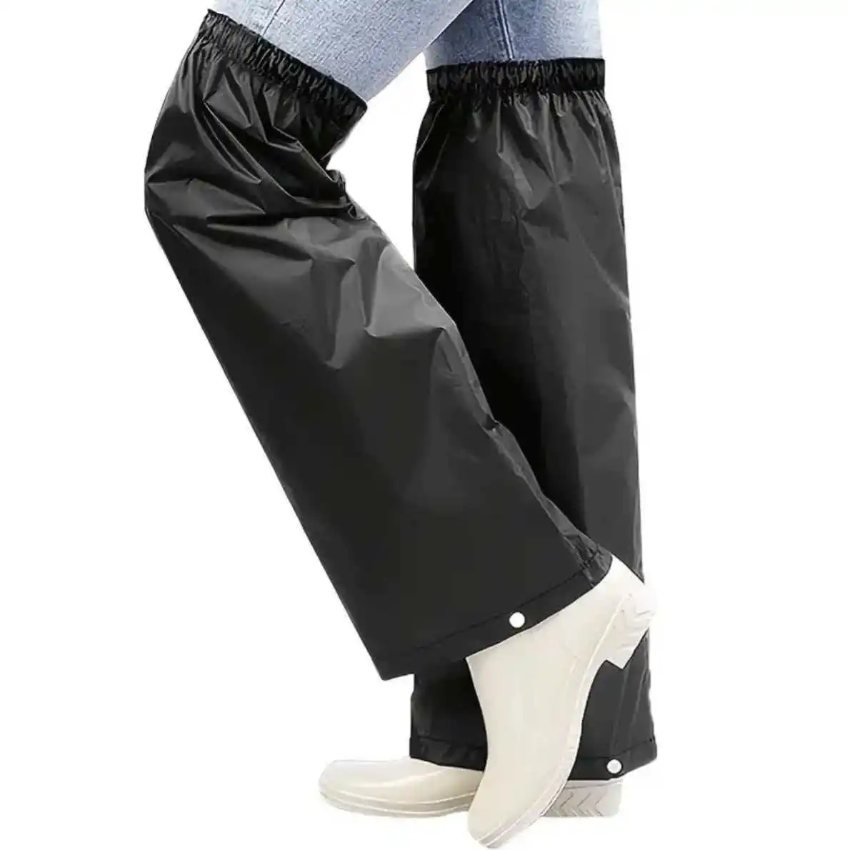A pair of black leg warmers, elastic design, multiple sizes available, essential for cycling and hiking in the rain
