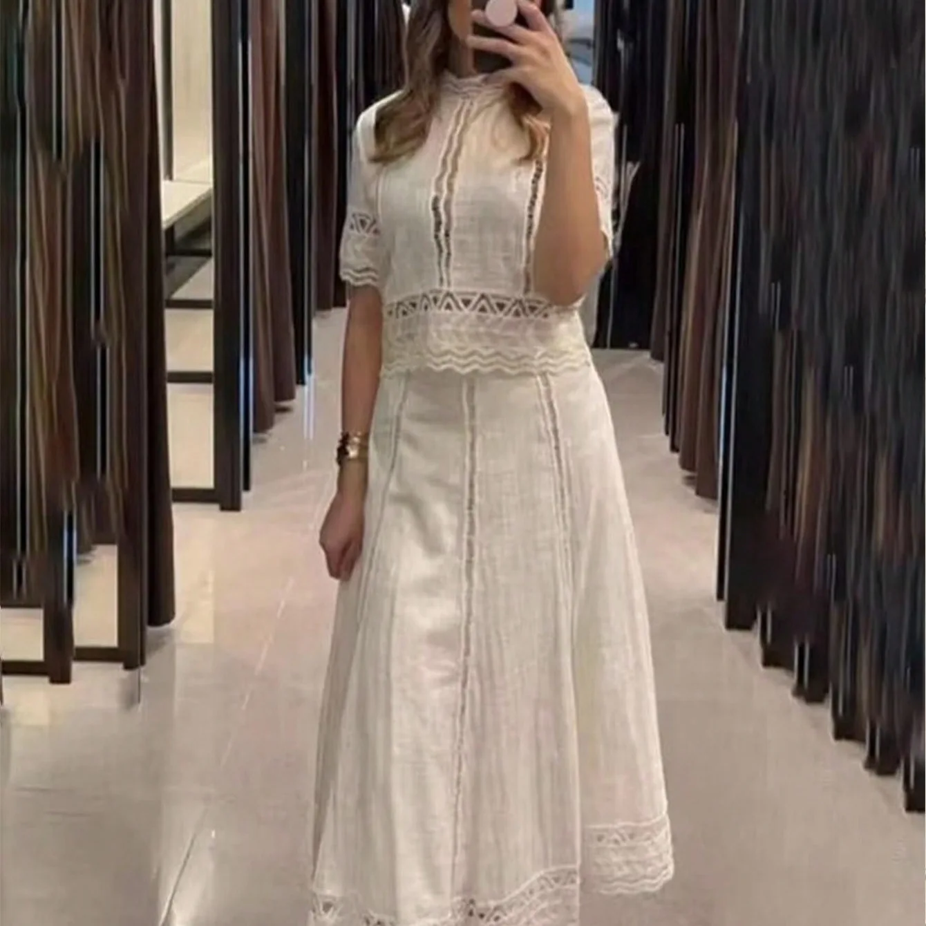 Set atasan dan rok wanita 2 potong, bordir elegan musim semi/gugur, model hollow out, kerah tinggi, lengan pendek, rok rajutan