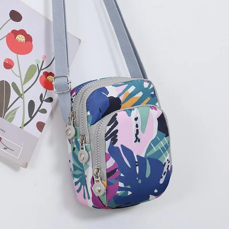 Women's new mini Oxford cloth wear-resistant vertical single-shoulder key change collection diagonal cross bag
