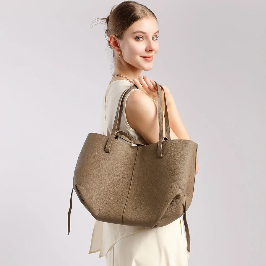 

2025 Новая женская сумка-тоут, универсальная корзина для покупок, сумка из воловьей кожи с верхним зерном, высококачественная сумка через плечо, сумка для матери и ребенка.