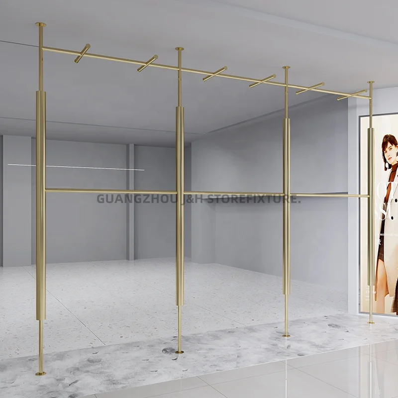 customized.New popularity wall mount garment rack high end clothing shop display stand golden clothing display rack