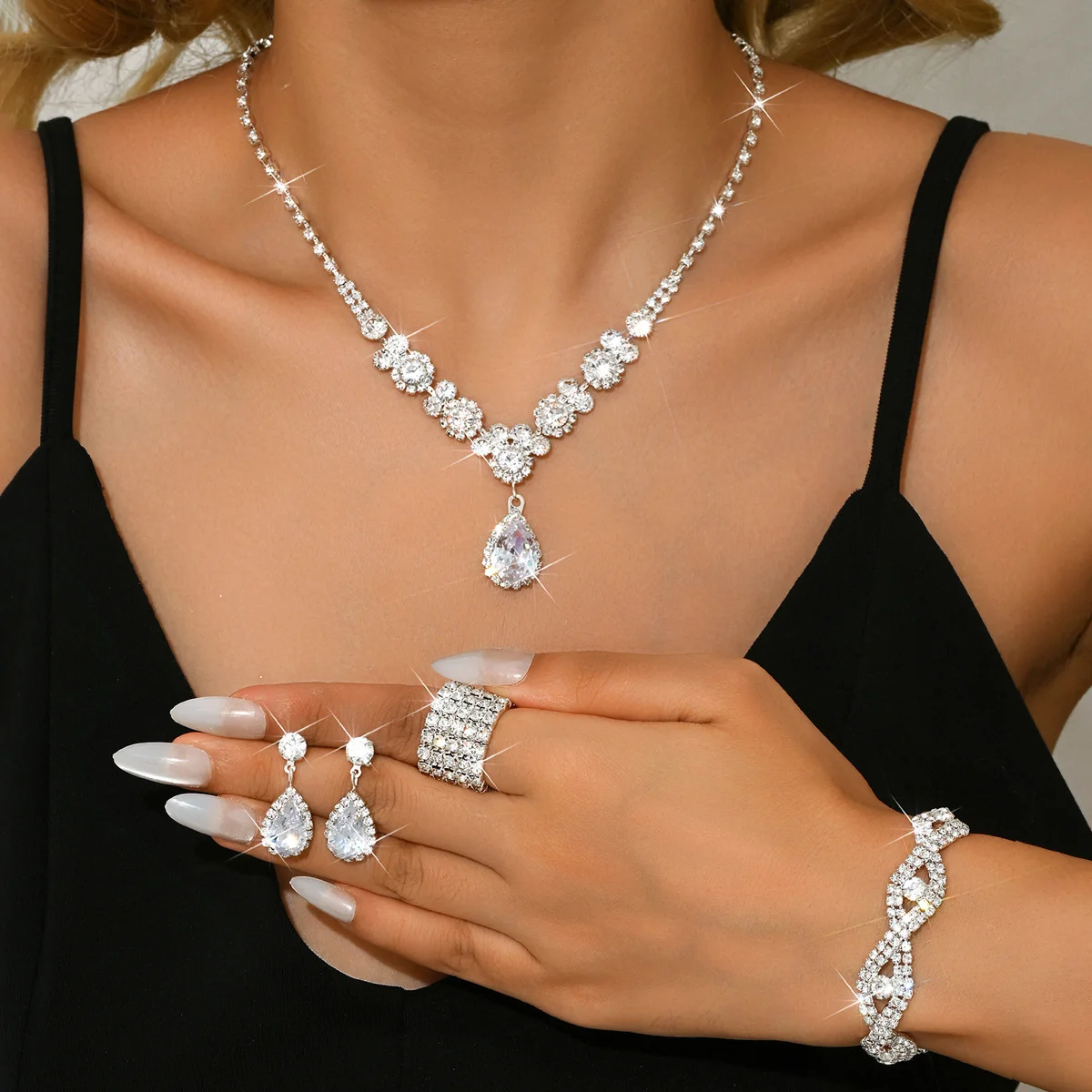 

Zircon water droplet necklace, earrings, bracelet and ring set of four pieces. Wedding accessories for the wife as a gift