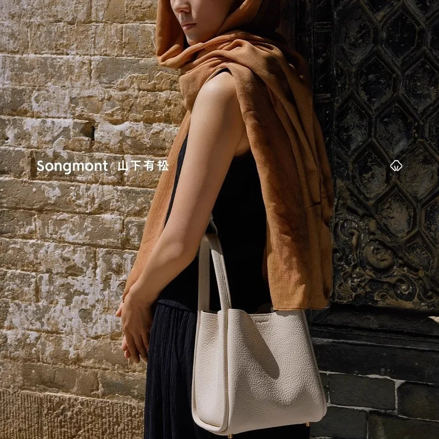 Songmont mid-sized and small-sized vegetable basket new version lock buckle top layer cowhide large capacity commuter bucket bag