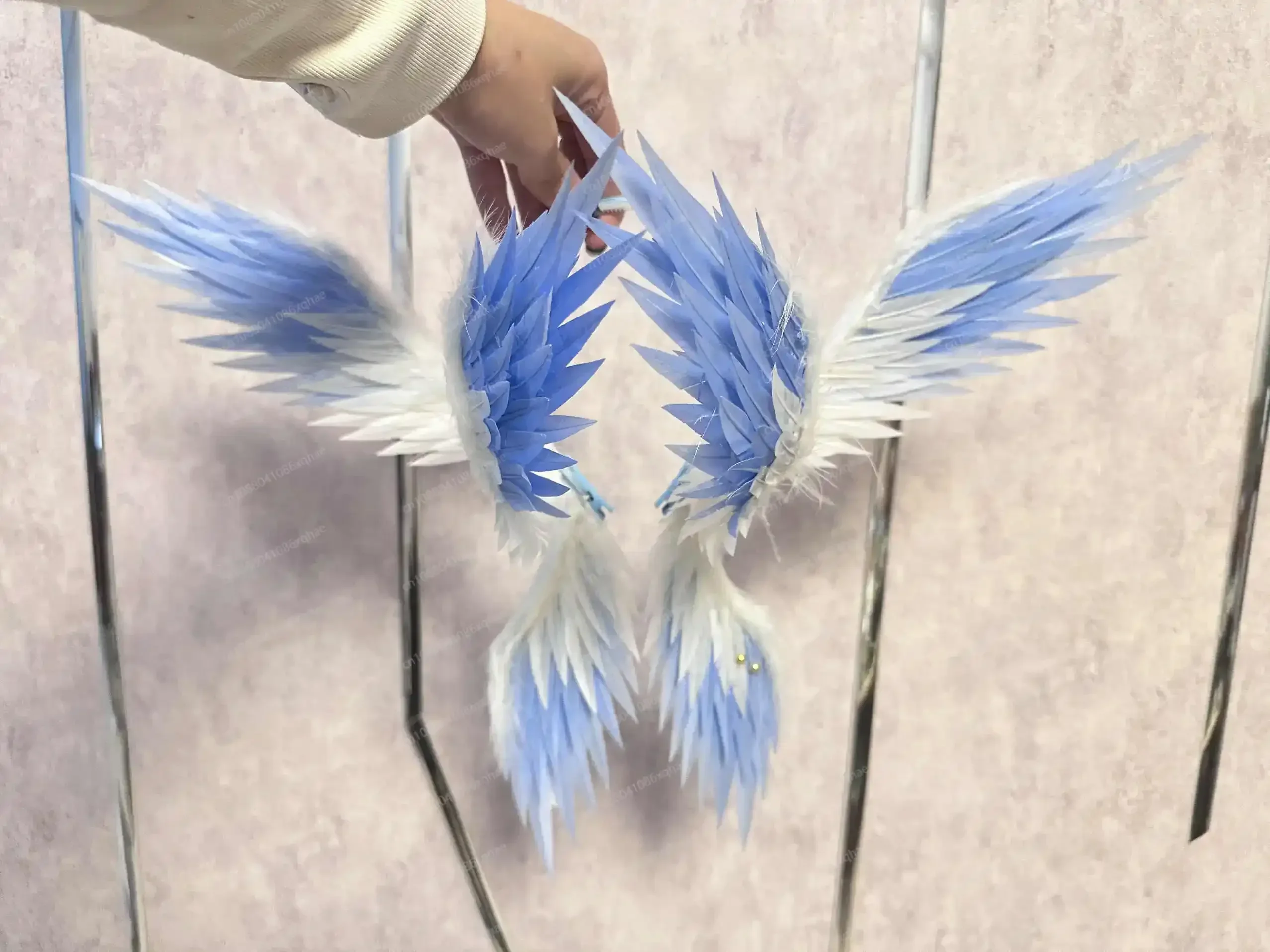 Cosplay accessory from the game, specifically a six - winged feather headpiece for the character