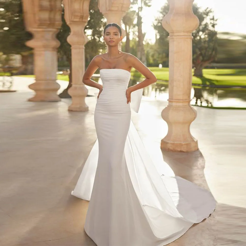 

Белое свадебное платье русалки без бретелек с длинным шлейфом по индивидуальному заказу, простое плиссированное платье без рукавов, на пуговицах сзади и бантом
