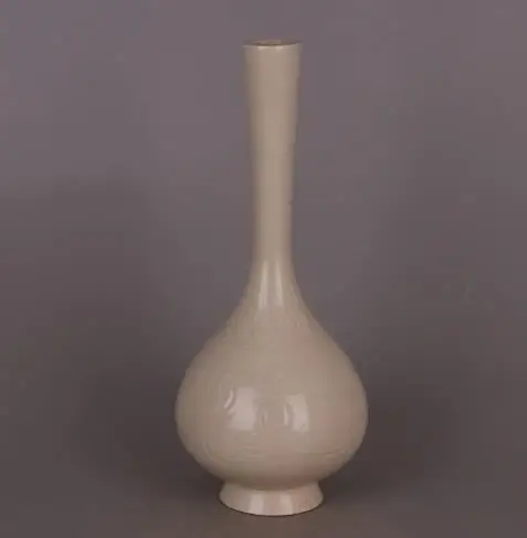 Antique ornament: Porcelain vase with carved flower patterns from Dingyao Kiln in the Song Dynasty