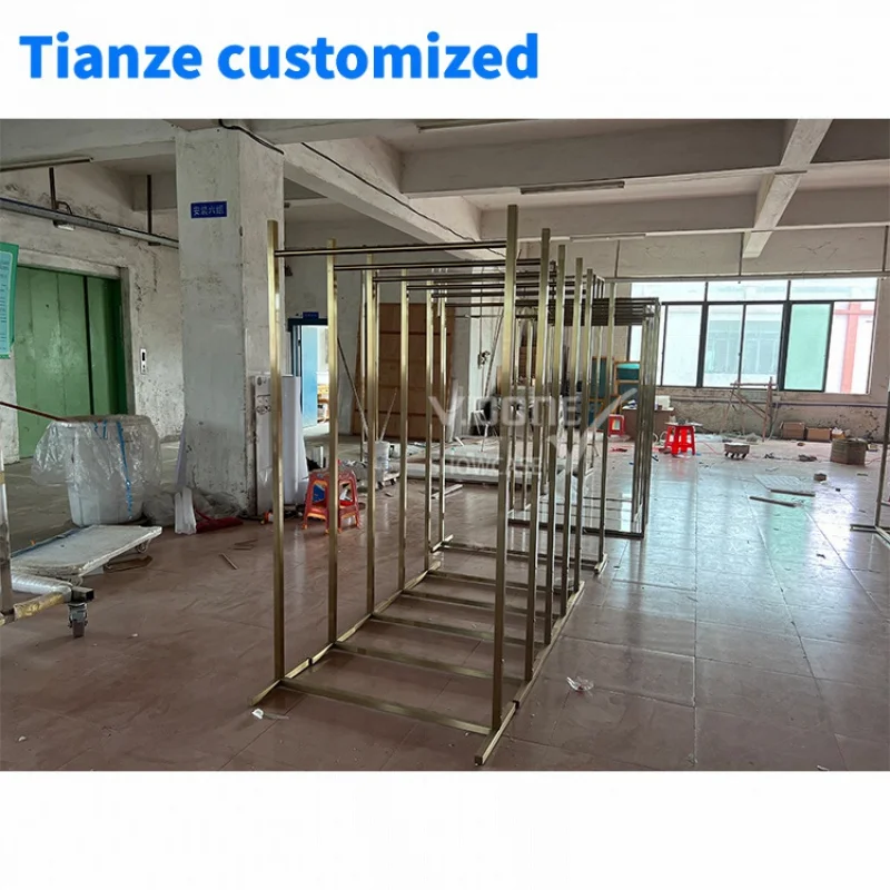 [Customized]Modern Famous Customized Hanging Garment Display Rack Golden Clothing Display Stand Clothes Store Interior