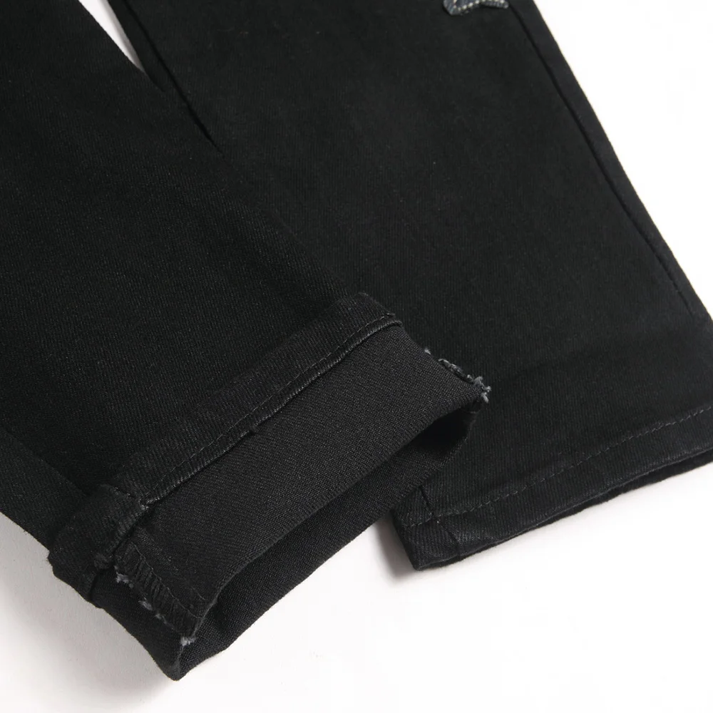 Pantalones vaqueros con parche de huesos para hombre, ropa de calle, pantalones elásticos rasgados con agujeros, Pantalones rectos ajustados Punk negros