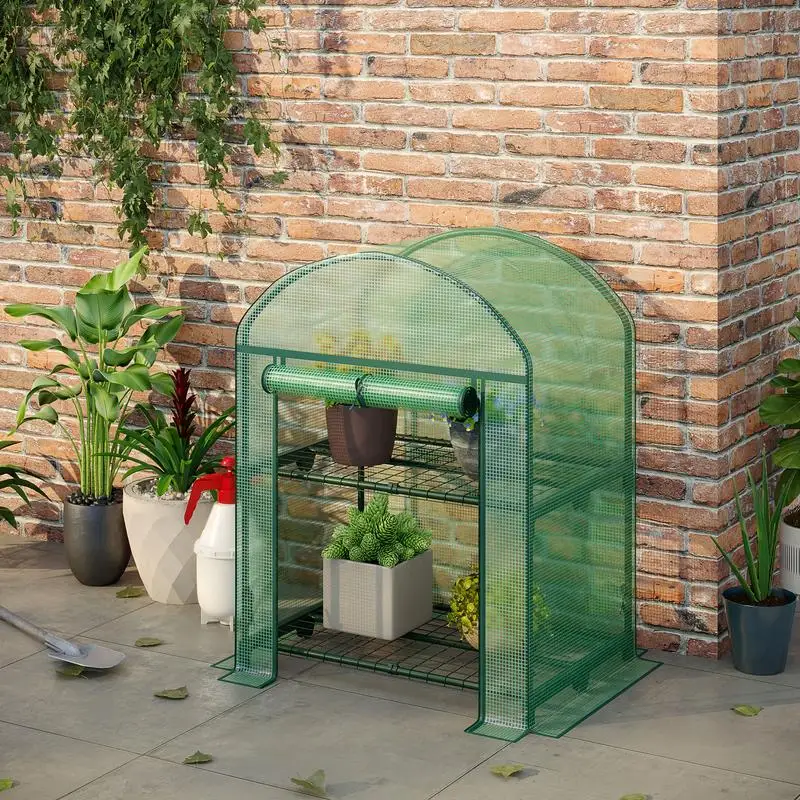 Mini-Gartentreibhaus in Grün 69x49x92 cm mit 2 Metallregalen und PE-Abdeckung, kompakte Konstruktion mit Rolltür für vertikale Anzucht von Setzlingen, aromatischen Kräutern und kleinen Gemüsesorten