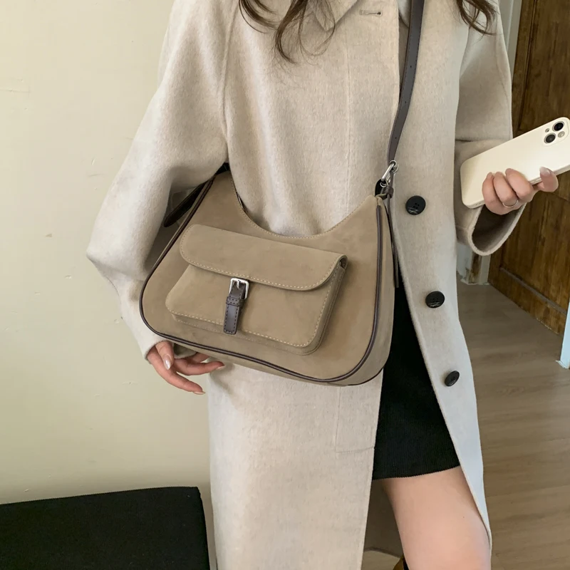 الكورية نمط Ins المتخصصة تصميم ريترو الجلد المدبوغ حمل حقيبة للنساء 2025 جديد الخريف والشتاء ركاب الكتف حقيبة كروسبودي 7573XMT