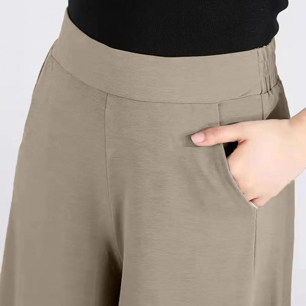 Брюки с широкой талией. Женские широкие брюки с высокой талией и карманами. Однотонные костюмные брюки для ношения. Удобный стиль. Однотонные.