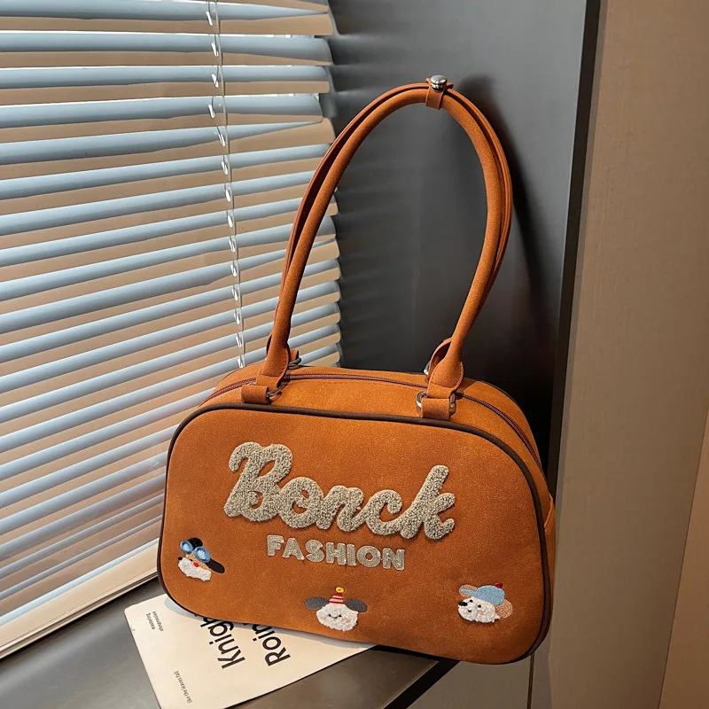 Hot-selling Korean version of cartoon cute embroidered handbag fashionable texture large capacity portable going out women's bag