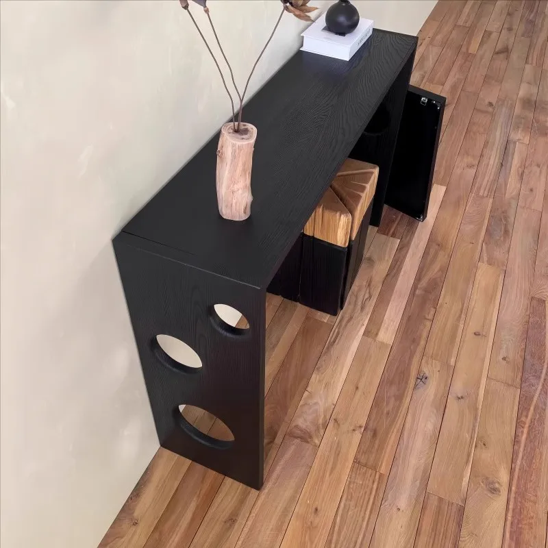 Black solid wood entrance table against the wall entrance end view table B & B hotel lobby table narrow