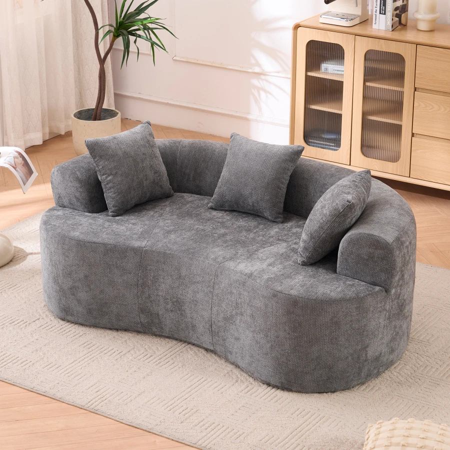 Crescent-shaped sofa, modern low-back design with deep cushions, featuring a self-inflating foam-filled three-seater sofa that