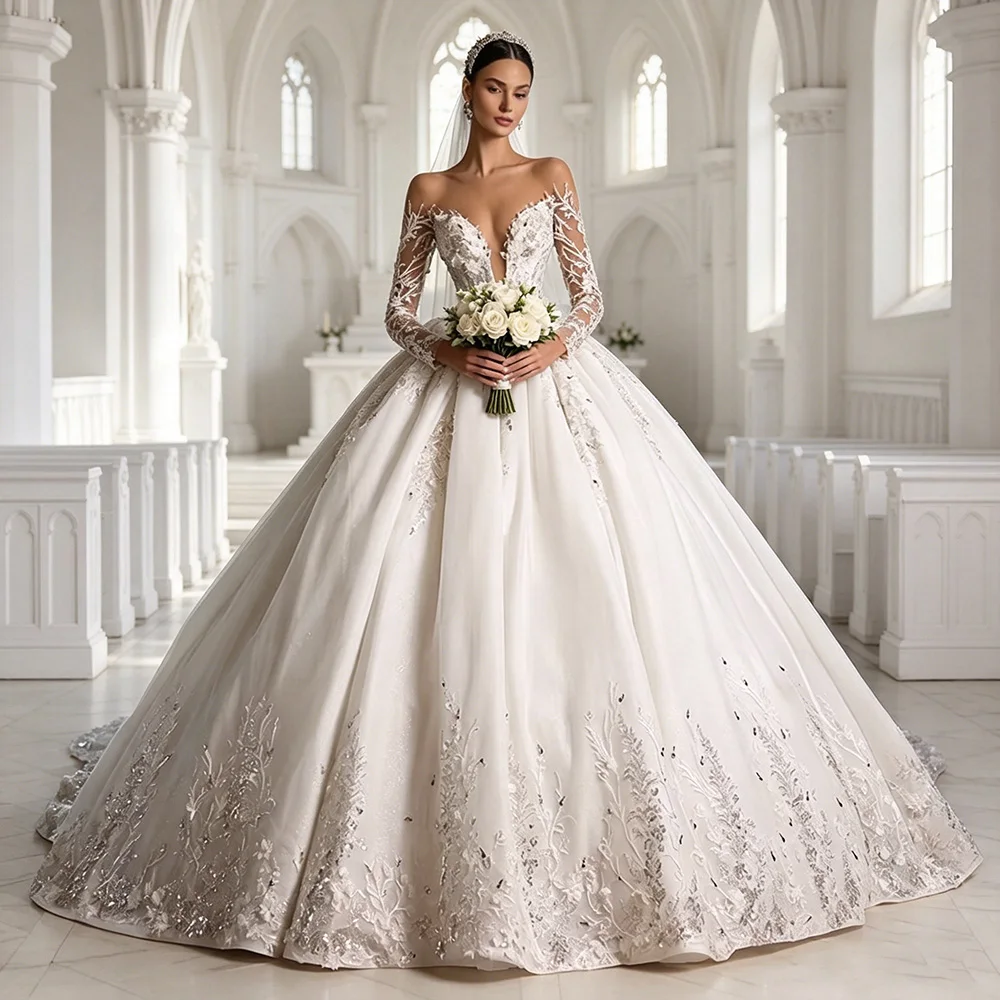 

Роскошное свадебное платье-баллон с индивидуальным пошивом, прозрачным вырезом, длинными рукавами, бисерной отделкой и аппликациями для невесты