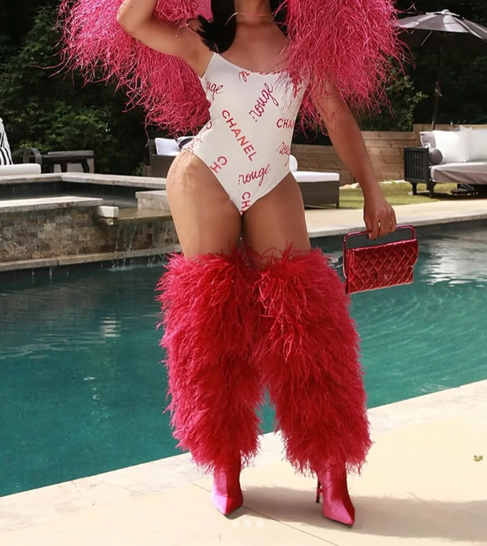 

Hot Pink Feather Stiletto Heel Over-the-Knee Boots Plush Fluffy Feather Trim Bold Vibrant Hue Pointed-Toe Edgy Clubwear Looks