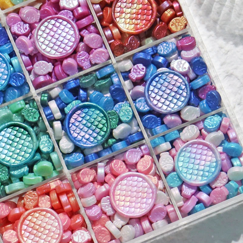 

24 цвета/коробка, форма маленькой рыбы, огненная краска, уплотнительные частицы воска, приглашение «сделай сам», письмо/ручная книга, уплотнение, декоративные материалы