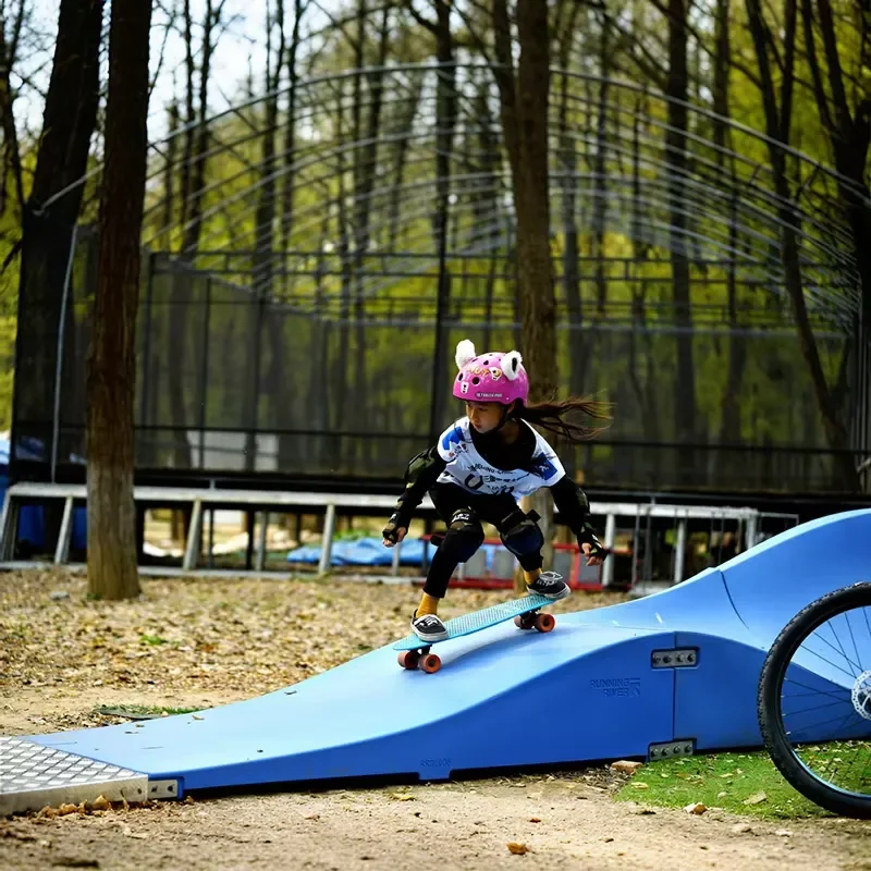 Plastic Modular Pump Track Velocity Loop 2 Is a Sequence of Roll Overs and Berms for Bikes, BMX Scooters and Skateboards