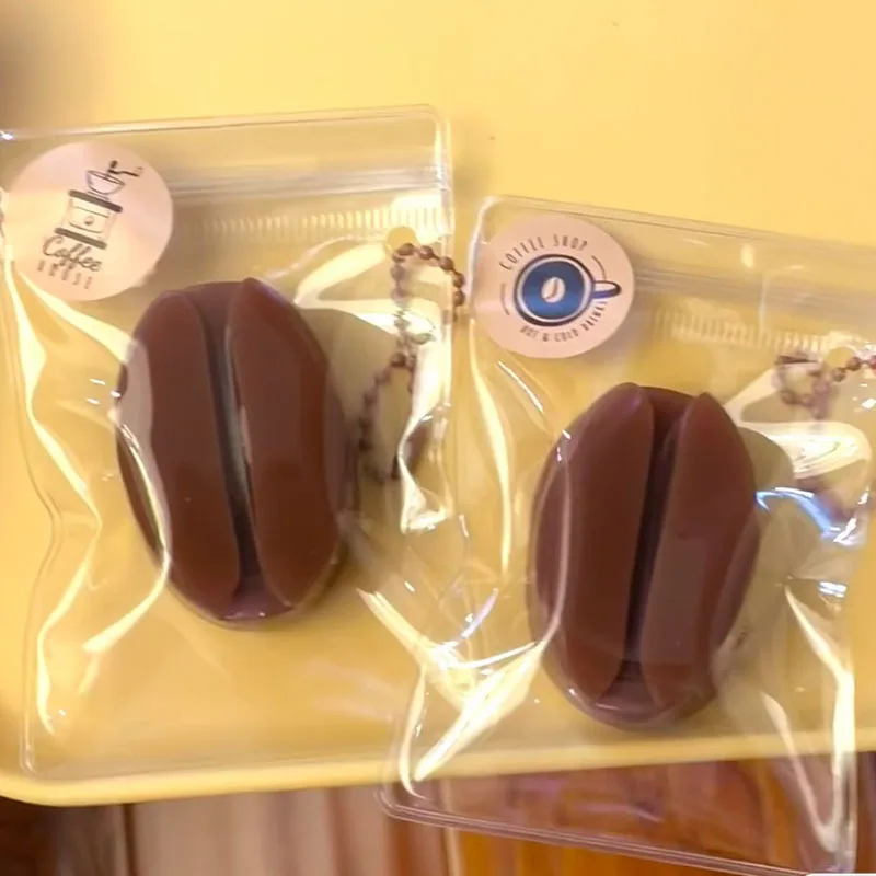 

Kawaii Coffee Bean Squeeze Toys Imitation Squishy Silicone Feel Pressure Relief Keychain Hanging Ornament Gifts for Children